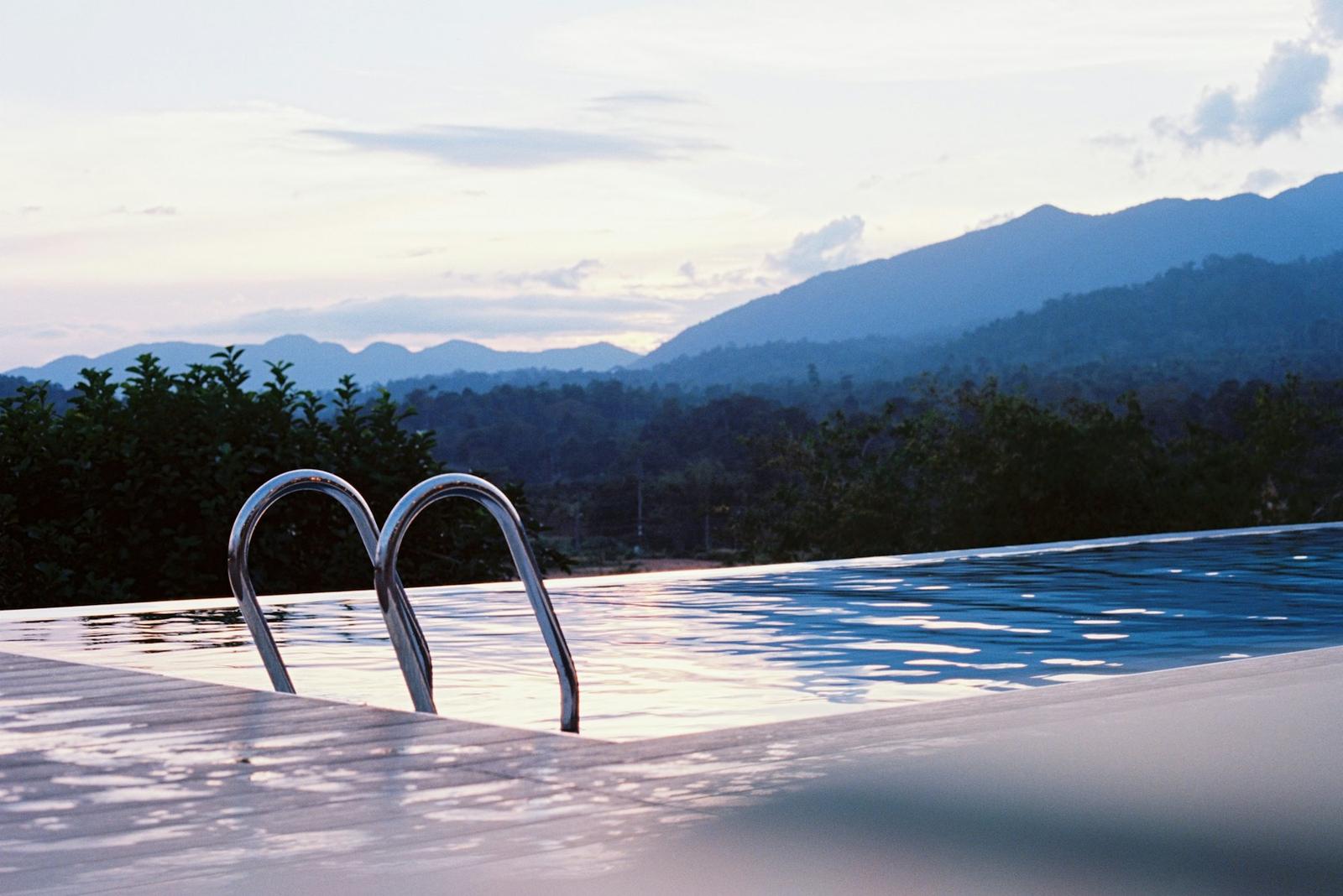 An infinity-edge pool facing the mountains